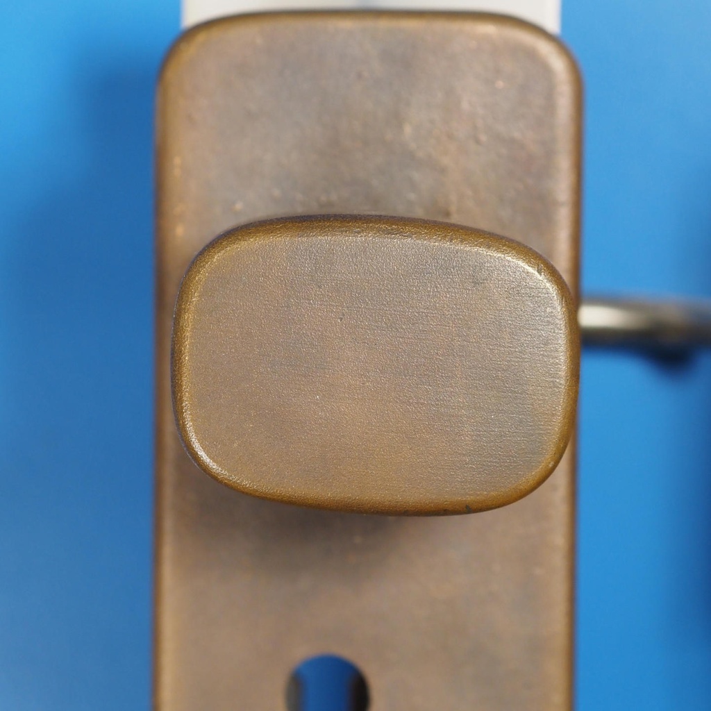 Door handle in solid bronze and stainless steel by Jules Wabbes (ca. 1970)
