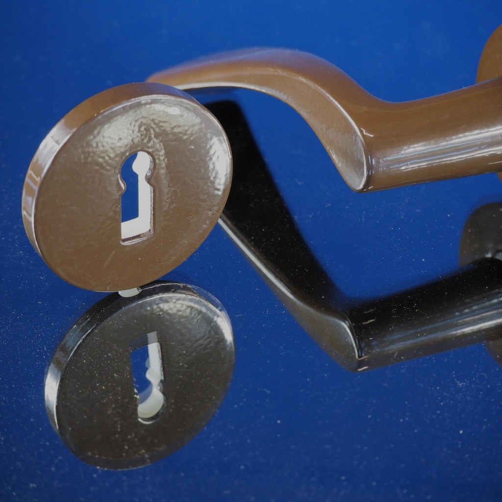 Door handle in brown coated stainless steel with key rosettes