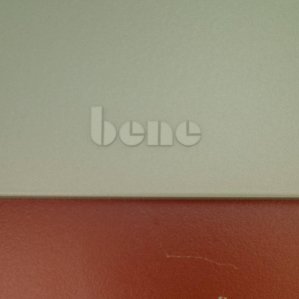 Table with orange laminated tabletop and powder coated steel legs by bene