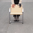 Armchair in chromed steel and synthetic leather