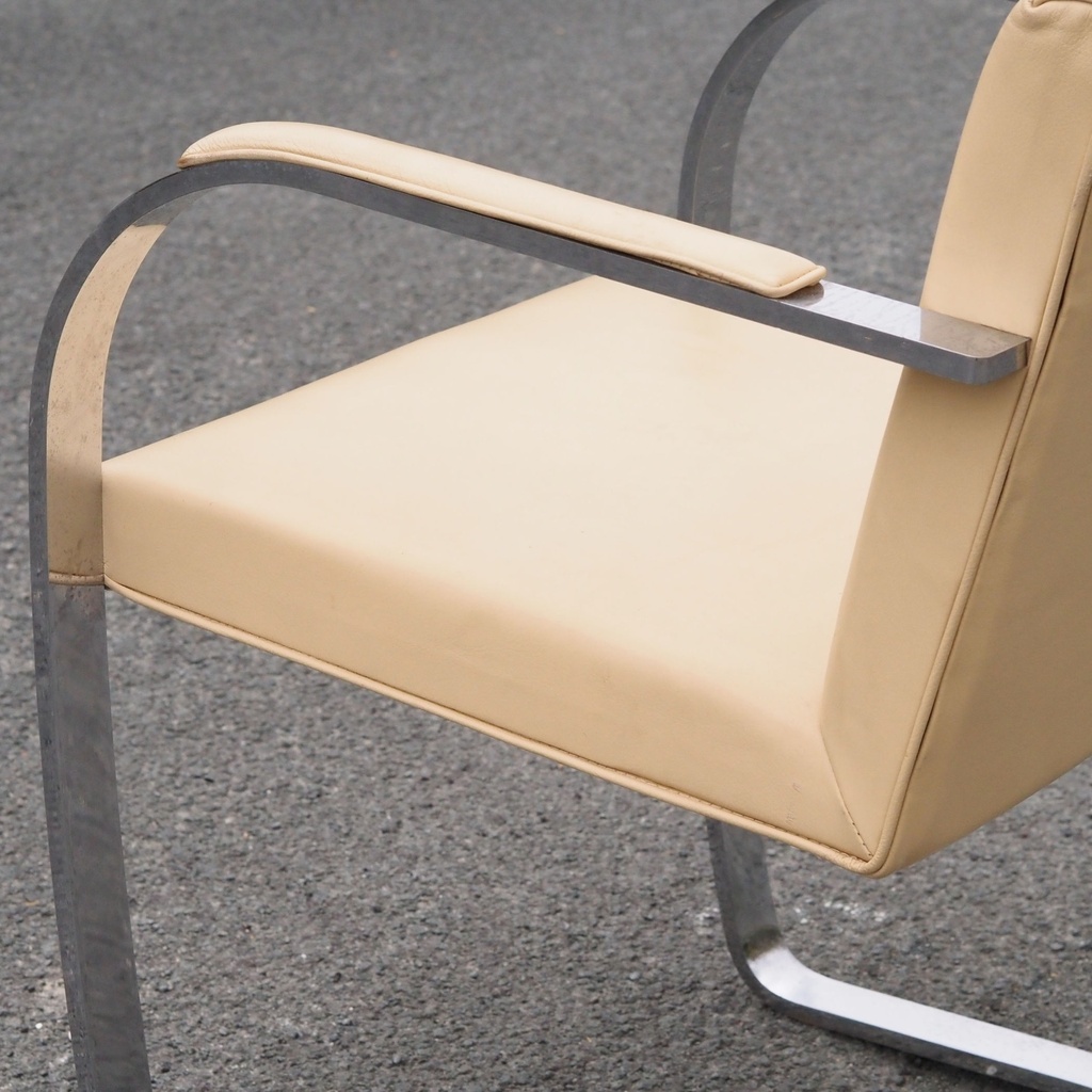 Armchair in chromed steel and synthetic leather