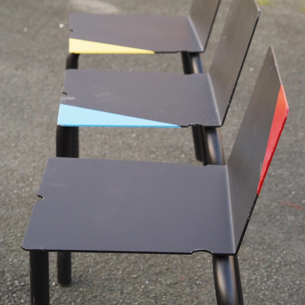 Black stackable chair by Pierre-Emmanuel Vandeputte (with various coloured corners)