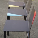 Black stackable chair by Pierre-Emmanuel Vandeputte (with various coloured corners)