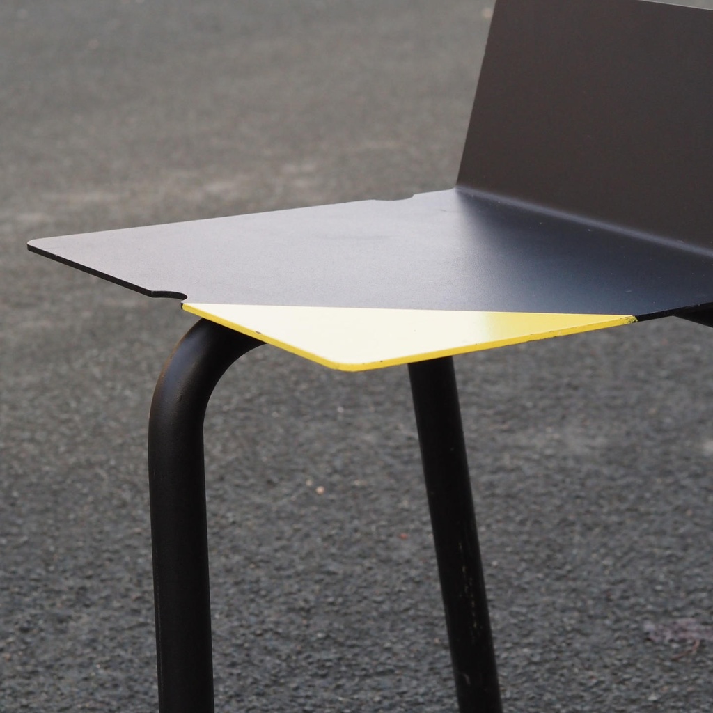 Black stackable chair by Pierre-Emmanuel Vandeputte (with various coloured corners)