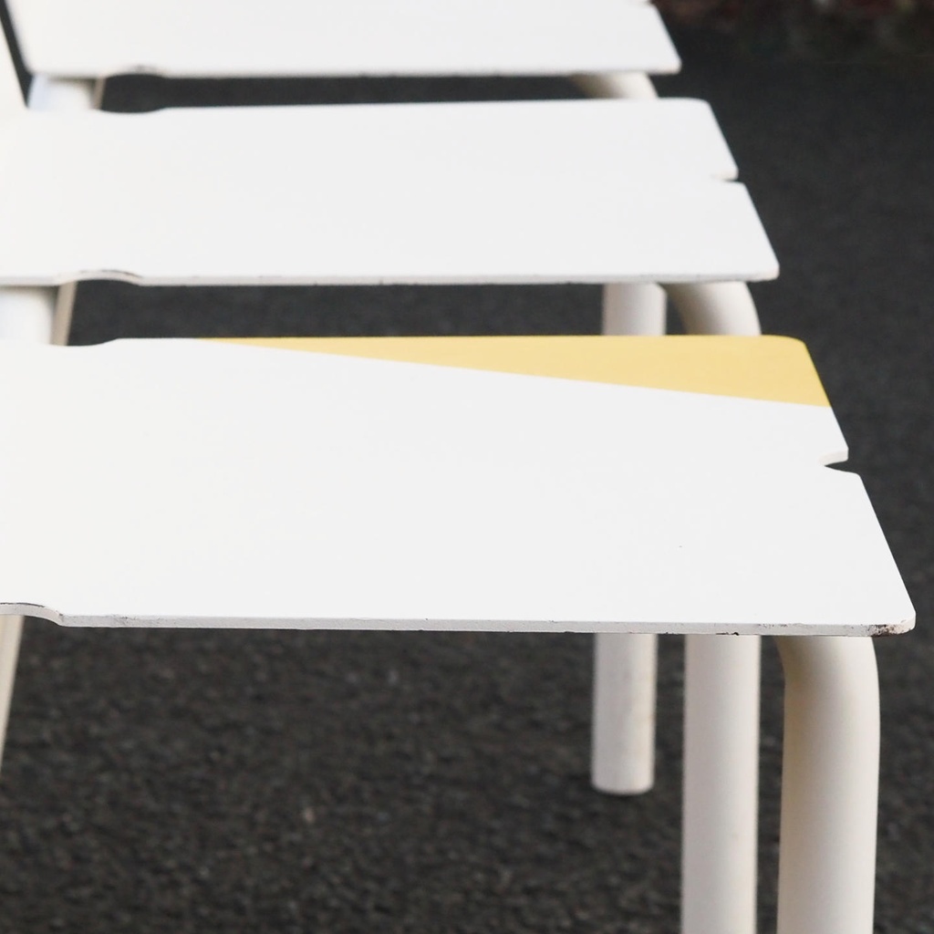 White stackable chair by Pierre-Emmanuel Vandeputte (with various coloured corners)