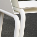 White stackable chair by Pierre-Emmanuel Vandeputte (with various coloured corners)