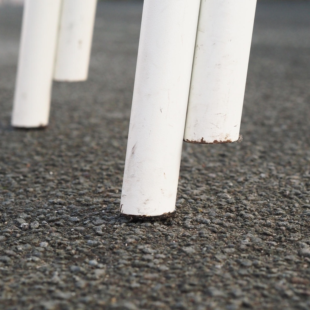 White stackable chair by Pierre-Emmanuel Vandeputte (with various coloured corners)
