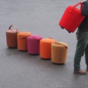 Round ottoman with belt by Satelliet (various colors/finishes)