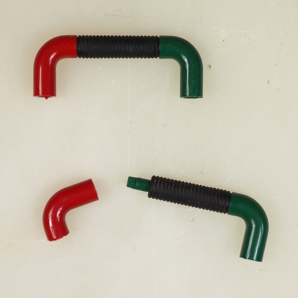 Colourful plastic cabinet handle with black rubber (ca. 1980)