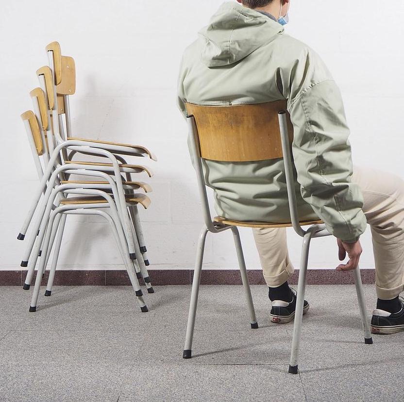 Stackable chair in plywood and lacquered steel
