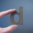 Letter 'd' in sand-cast bronze by Jules Wabbes from the Générale de Banque