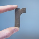 Letter 'r' in sand-cast bronze by Jules Wabbes from the Générale de Banque