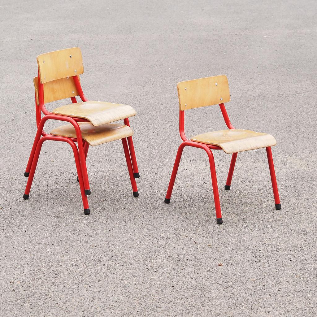 Stackable school chair with red tubular steel legs