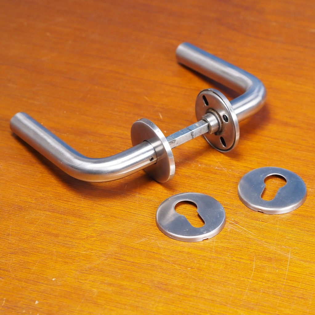 Door handle in brushed stainless steel with key rosettes